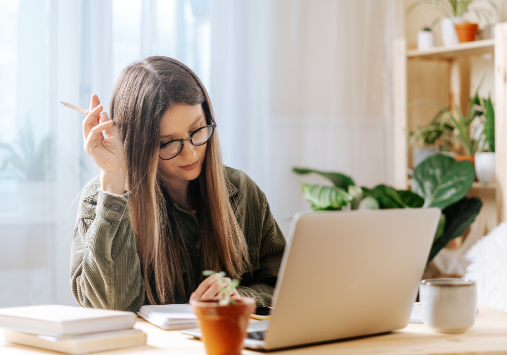 woman in her laptop thinking priorities in life