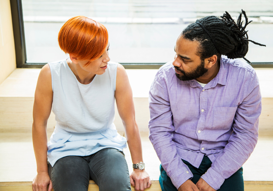 couple sitting together talking How To Reconnect After a Relationship Brea