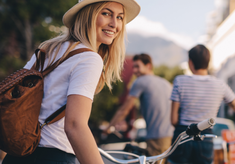 woman happy cycling How to Make a Guy Regret Ghosting You