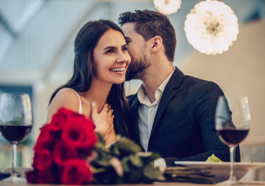 couple sitting at table woman smiling How to Respond to 