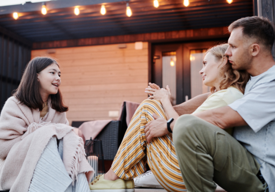 three people sitting outside talking Become More Emotionally Available