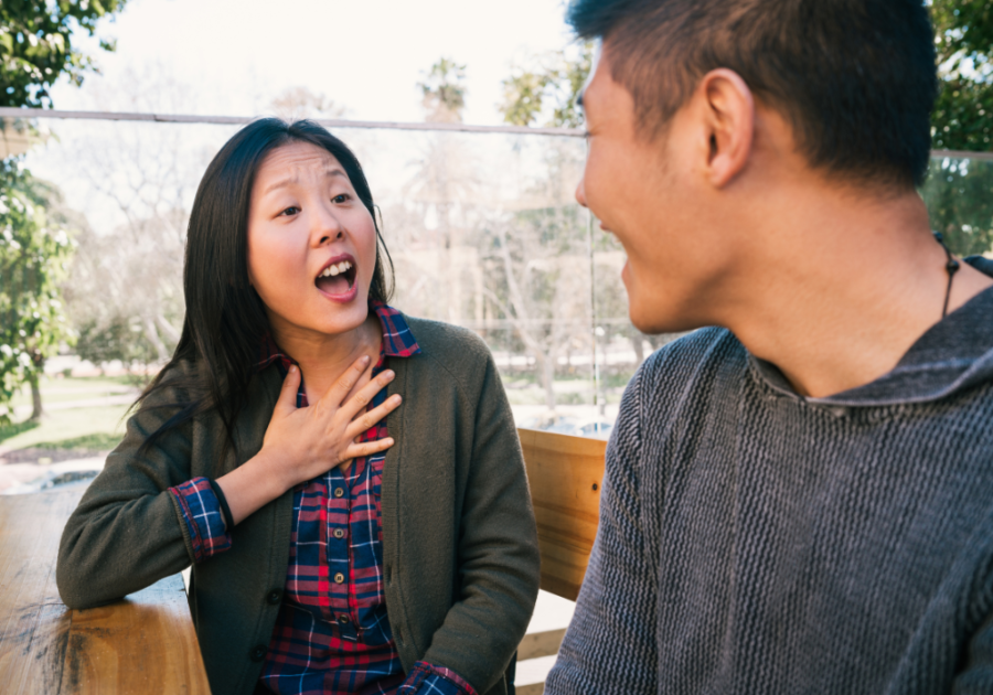 woman and man sitting together how to Stop Talking So Much