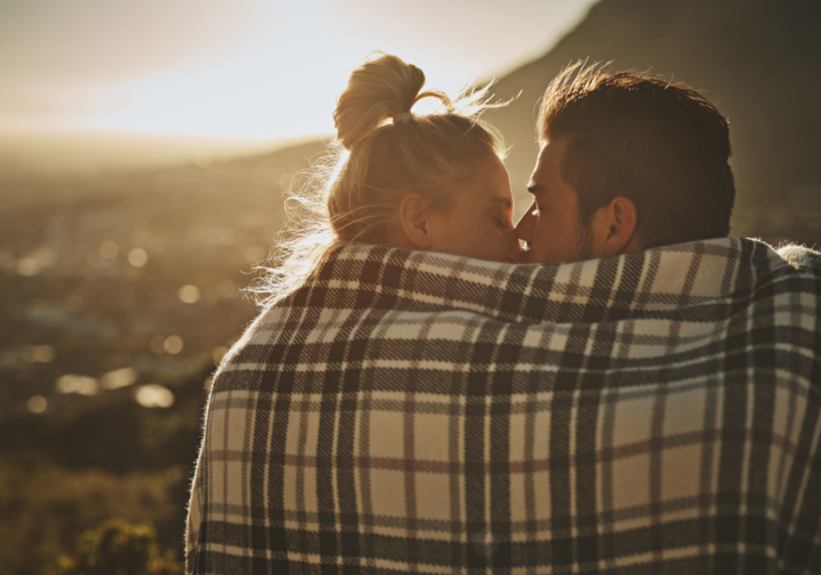 couple kissing at sunset under blanket Sexual Soul Ties