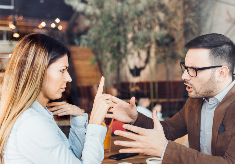 couple arguing at table signs of a Condescending Person