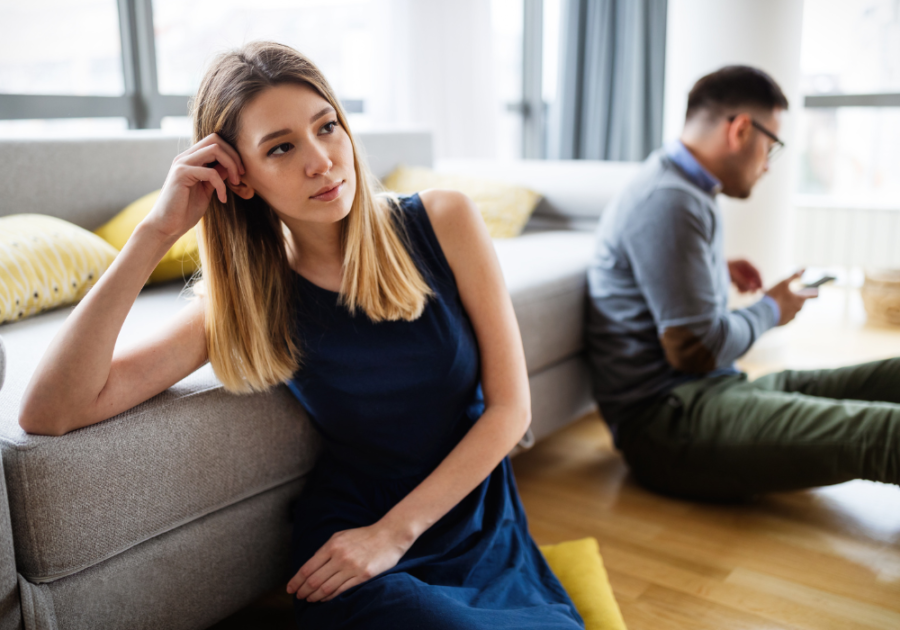 couple sitting on floor beside sofa Signs Your Marriage Will End in Divorce