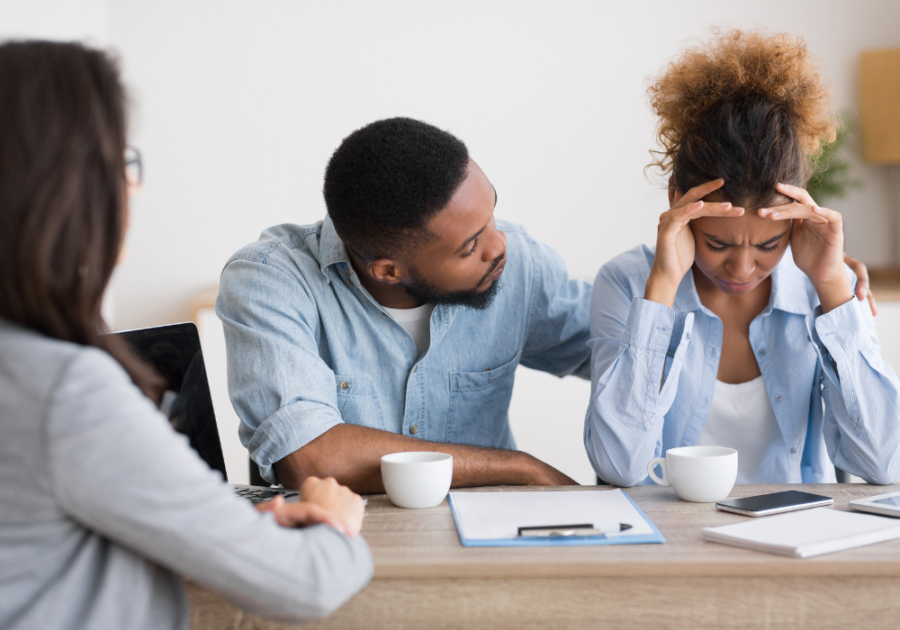 woman crying at table with counselor My Husband Gets Mad At Me When I Tell Him He Hurt My Feelings