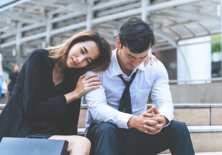 woman leaning on man at train station Signs You Are Forcing a Relationship