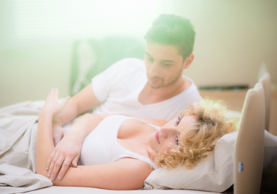 couple laying in bed false twin flame