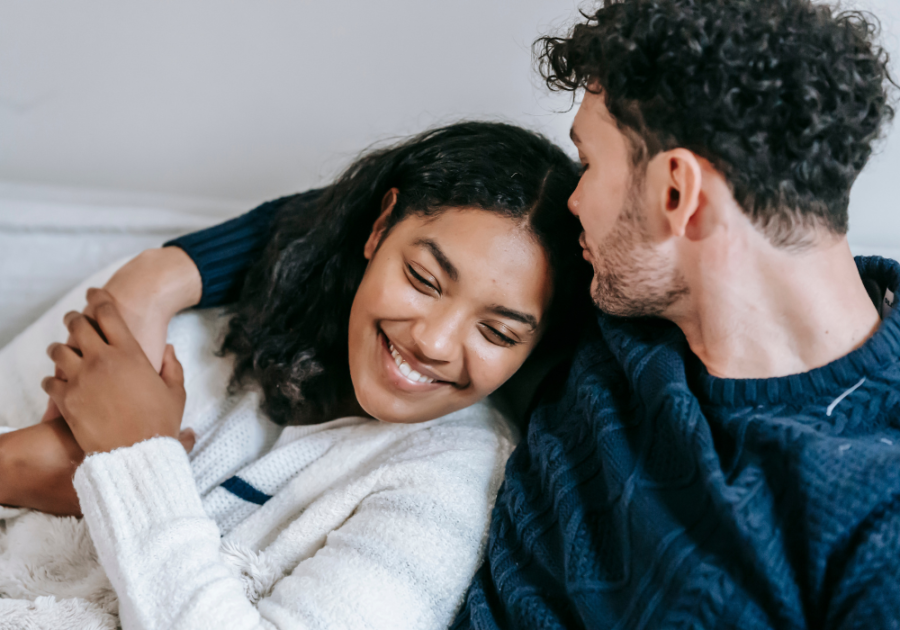 couple sitting close on sofa Taurus Man and Gemini Woman Compatibility