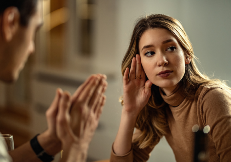 woman looking away from man begging Falling Out of Love After Infidelity