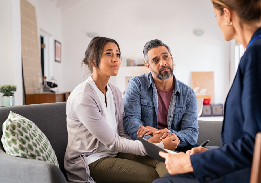 couple talking to professional in office My Husband Loves Me but Not Sexually