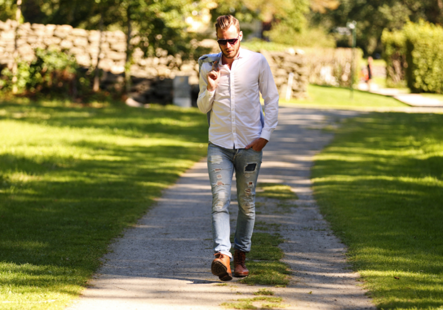 man walking alone on long driveway Signs of a Zeta Male