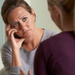 older woman sad talking to younger woman When Your Grown Child Breaks Your Heart