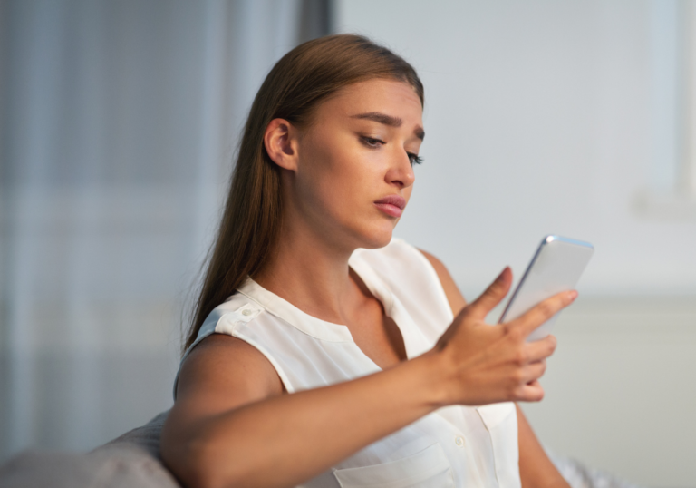 woman sitting looking at phone Hysterical Bonding