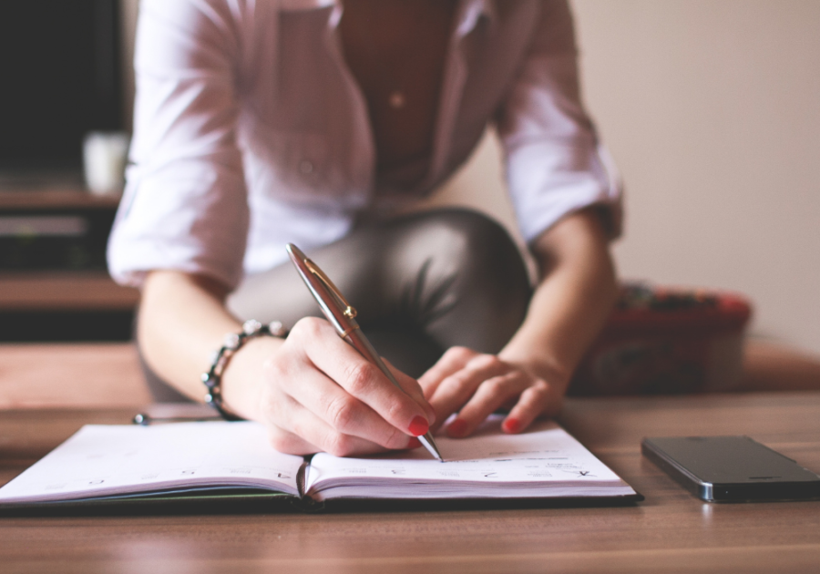 woman writing in journal  Love Poems For Crush