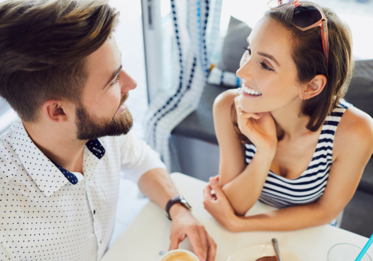 couple sitting close talking What to Talk About With Your Girlfriend