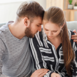 man consoling woman sitting on sofa Daddy Issues Quiz