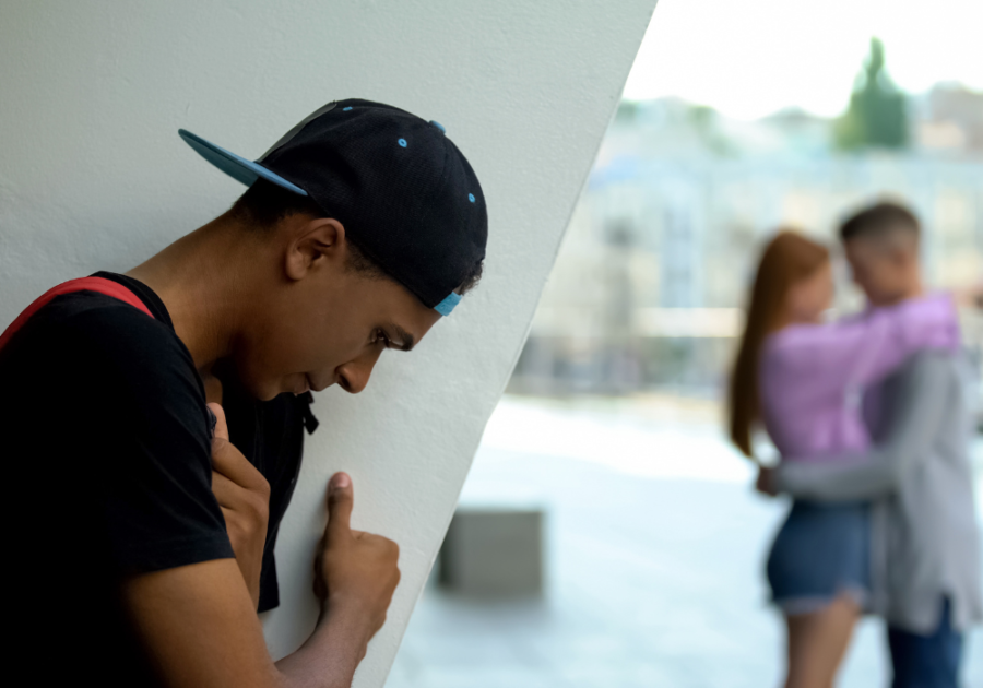 man feeling sad looking at a couple How Long Does a Crush Last?