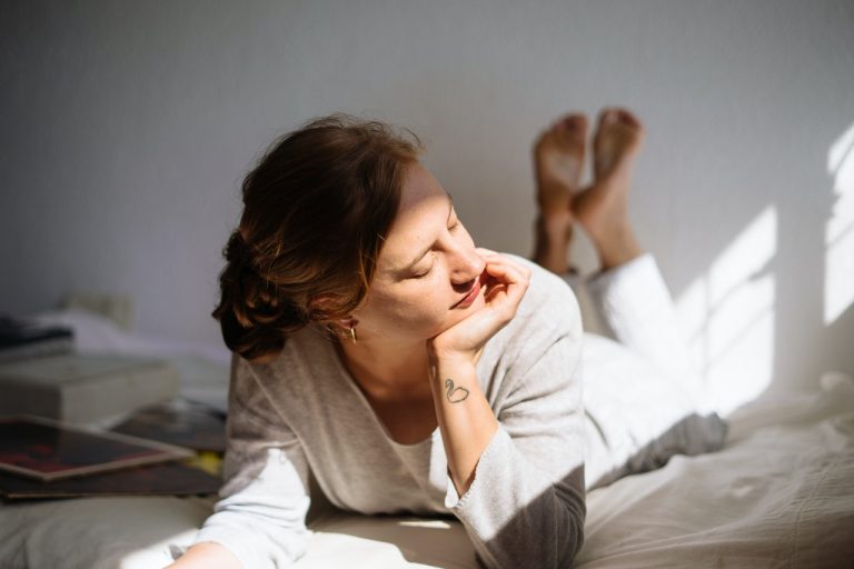 woman on bed, relaxing things to do