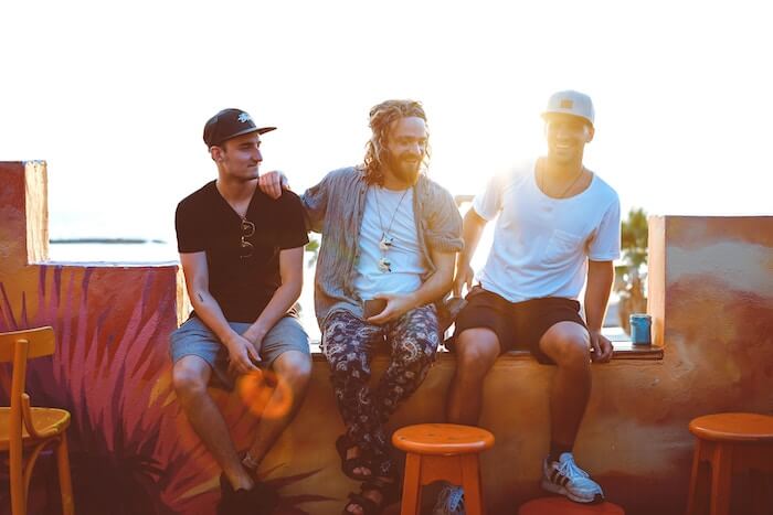 3 guys sitting laughing happy thoughts