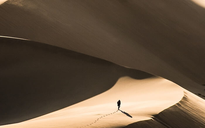 person alone in sand dunes how to find yourself