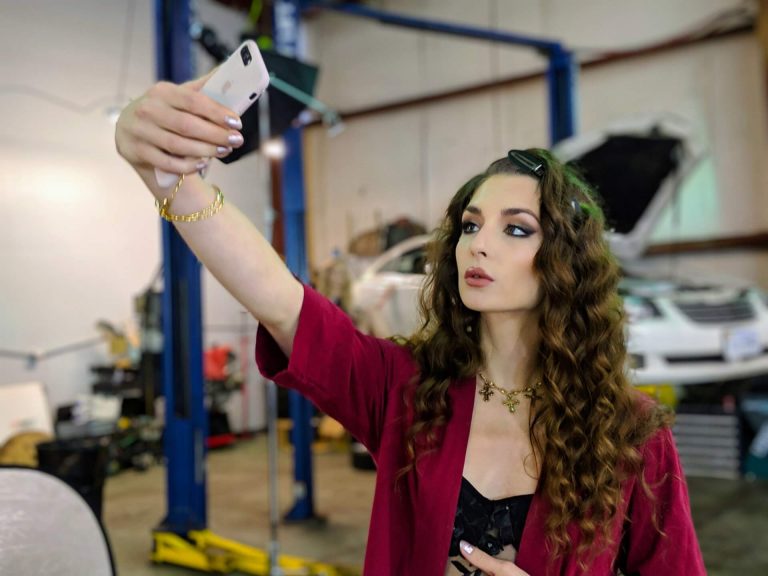 woman taking selfie, self-absorbed person