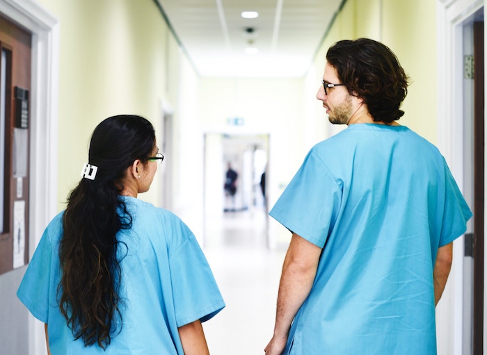 medical staff talking in hallway jobs for people with anxiety