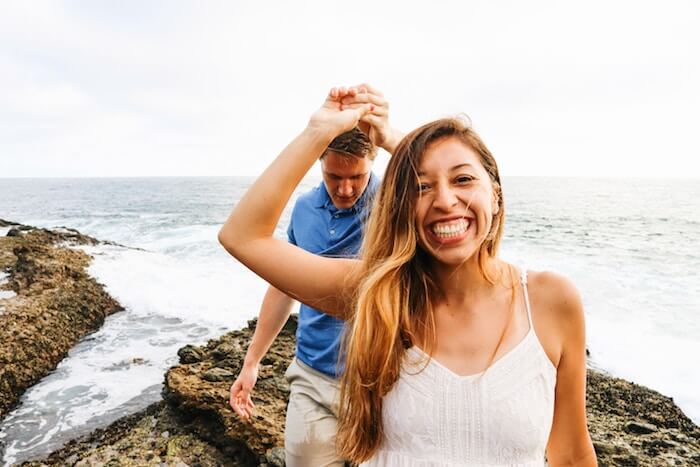 couple on rocks at ocean romantic things to do