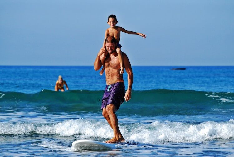 father son surfing summer bucket list