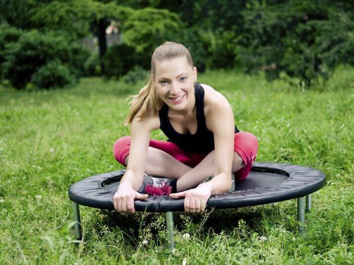 women stretching on rebounder benefits of rebounding