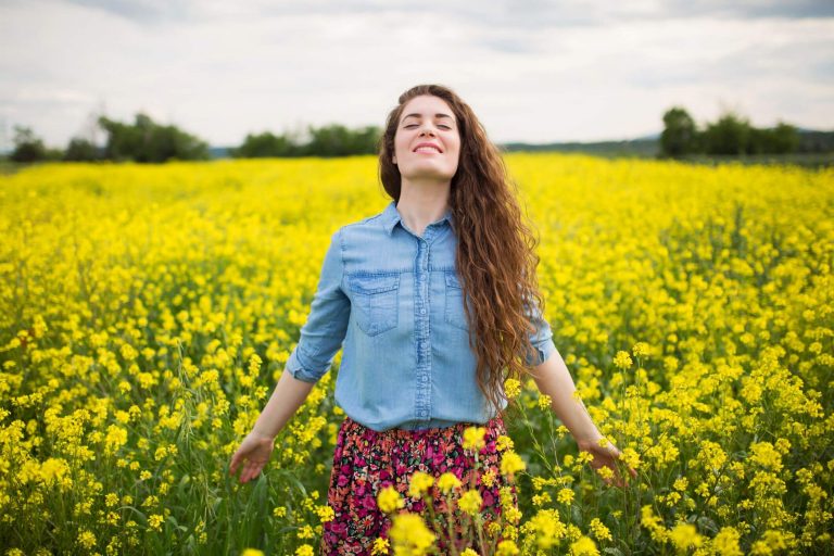 woman in flower field, affirmations for women