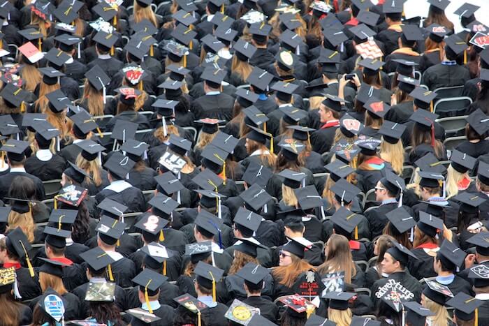 looking down on a crowd of student at ceremony graduation quotes