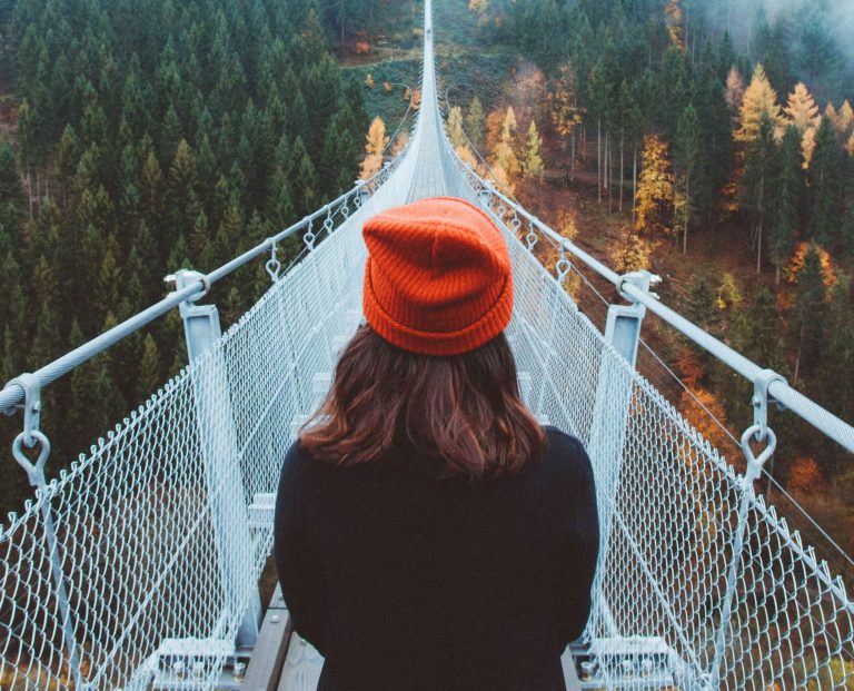 woman on bridge, overcoming adversity quotes