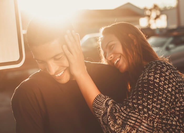 couple laughing touching is he in love with me