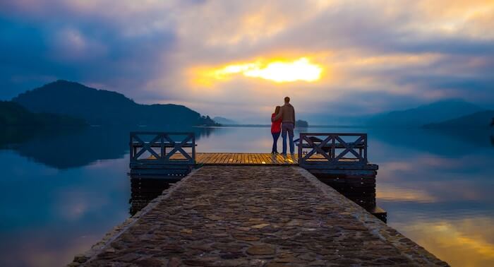 couple watching sunset on dock date ideas