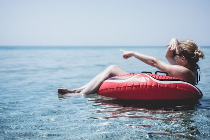 woman on river tubing fun date ideas