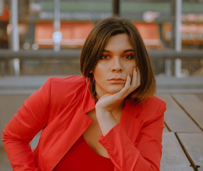 woman sitting at table outside lack of emapthy