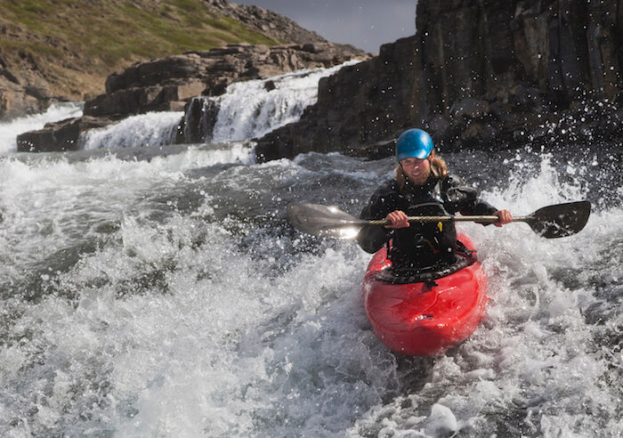 Man canoeing rocky waterfall believe in yourself quotes