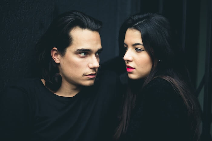 couple dressed in black face to face to Start a Conversation with a Girl