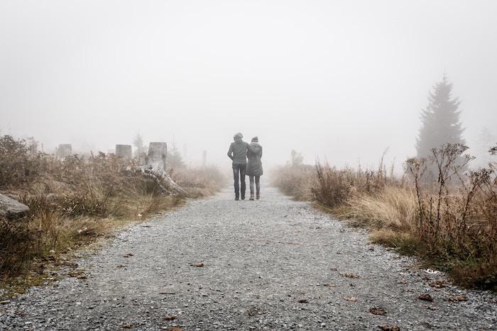 man and woman walking on trail communication exercises for couples