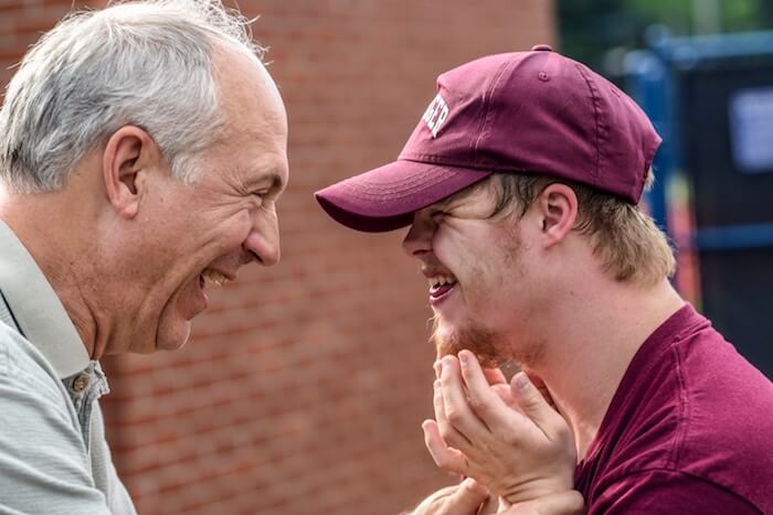 older man laughing with young male what is respect