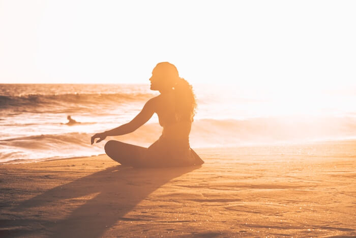 woman sitting on beach how To Let Go of Anger