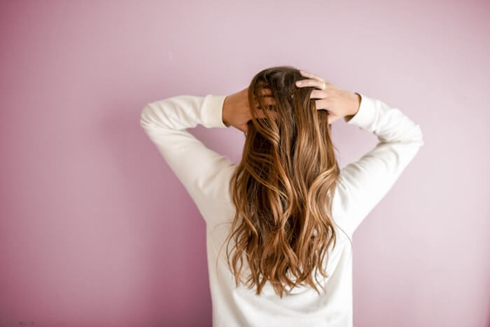 woman with long hair benefits of grapeseed oil