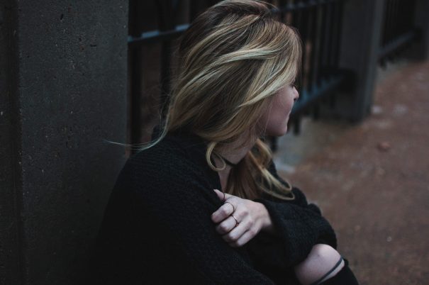 lonely woman sitting , too much empathy