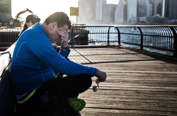 sad man sitting on dock, too much empathy