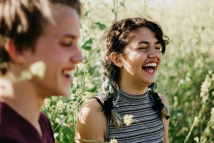 couple laughing outside how to build trust