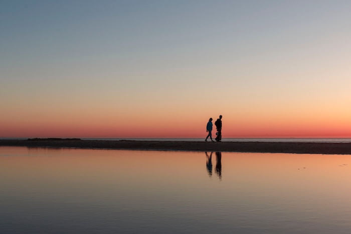 couple walking along beach Values In Life