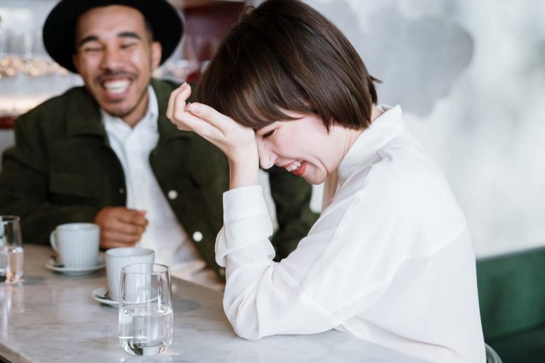 couple laughing, how to end a conversation