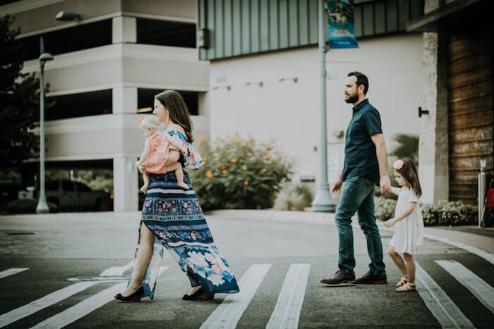 couple crossing street with children falling out of love