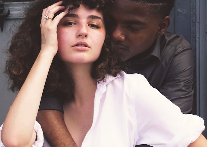 man sitting behind women hugging cute love quotes